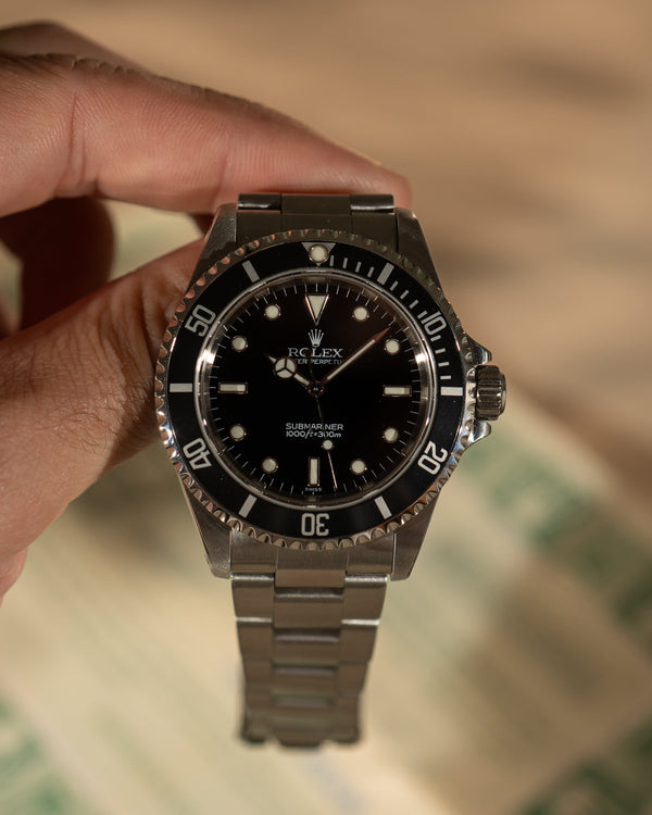 Rolex Submariner 14060 – With Papers (2000)